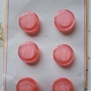 Vintage set of pink buttons on card!