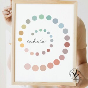 May include: A printable wall art print with a spiral of colorful circles and the word "exhale" in the center. The colors are muted and pastel, including shades of green, blue, yellow, pink, and brown.
