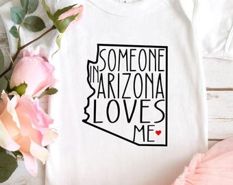 Body de San Valentín, Body "Alguien en Arizona me ama", Camiseta de bebé de Arizona, Regalos para baby shower, Camiseta de bebé amado, Body de bebé del estado