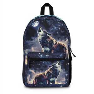 May include: A black backpack with a galaxy print featuring two howling wolves and a full moon. The backpack has a zippered pocket on the front.
