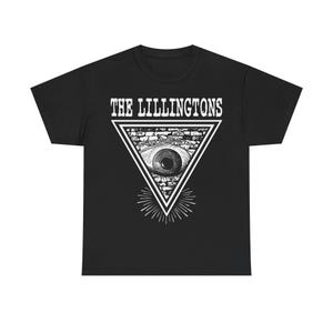 May include: Black t-shirt featuring a white graphic of a triangle with an eye inside, surrounded by rays of light. The text "THE LILLINGTONS" is above the triangle. The shirt is made of a soft, comfortable material.
