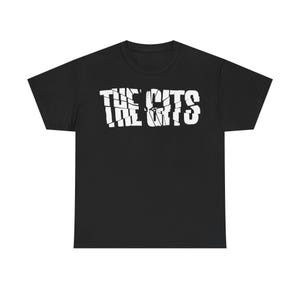 May include: Black t-shirt with the white text "THE GITS" in a distressed, cracked font. The shirt is a classic crew neck style, suitable for casual wear. The graphic is centered on the chest.