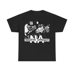 May include: Black t-shirt featuring a white graphic of a band performing on stage. The band's name, "NEGATIVE APPROACH," is printed in a bold, white font below the image. The shirt has a classic crew neck and short sleeves.