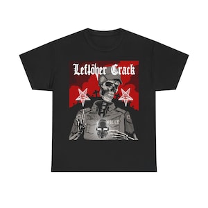 May include: Black t-shirt featuring a skeleton in a police uniform with the text "Leftöver Crack" above a red rectangle. The skeleton is giving the middle finger. Two red pentagrams flank the skeleton.