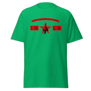 May include: A green t-shirt with a red star and the text "INLA". The shirt features a black graphic of a guitar and a banner that reads "Irish National Liberation Army".
