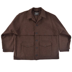 May include: A brown wool jacket with a button-up front, two chest pockets, and two lower pockets. The jacket has a collar and buttoned cuffs. The brand "FILSON" is visible on a tag near the collar.