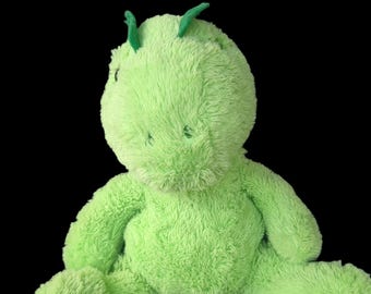 Contenitore segreto a forma di dinosauro in peluche, ideale per nascondere denaro, gioielli ed erbe aromatiche. Adatto a bambini e adulti.