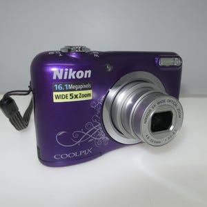 Nikon COOLPIX Coolpix A10 Compact Digital Camera purple color +memory card, screen and lens are clean, Tested and Works. Excellent condition