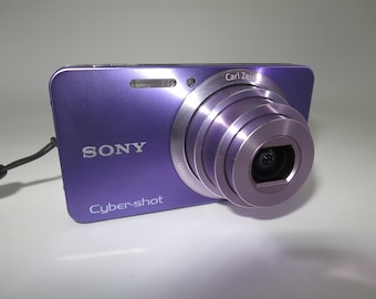 Sony Cyber Shot DSC-W570 16.1MP 5x purple Compact Digital Camera + original charger + battery + memory card + case, Tested and Works