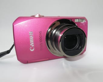 Cámara digital compacta Canon IXUS 1000 hs / Elph SD4500 / ixy 50s rosa, 10 MP, Full HD, batería original, cargador, memoria de 32 GB. Probada y en funcionamiento.