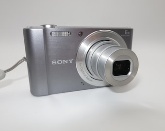 Sony Cybershot DSC-W810 20.1MP 6x zoom Compact digital camera silver color 32GB, usb charger, battery - Tested & Works Excellent