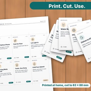 May include: A printable sheet and a stack of white cards featuring daily routine tasks with icons and text. Each card includes a time estimate and a label. The text includes phrases like Water Before Phone, Feet On Floor, and Dishes to Kitchen. The cards measure 63 x 88 mm.