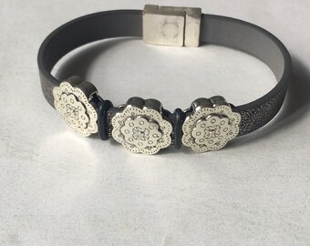 Metallic grey leather cuff bracelet with antiqued silver flower sliders