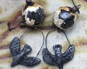 Black ceramic crow dangle earrings with black stoneware drops