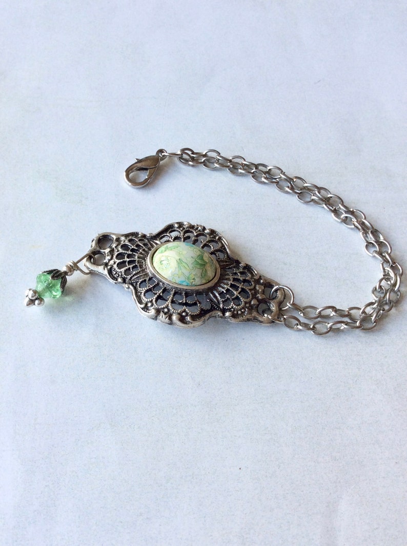 Antique silver filigree bracelet with floral Japanese porcelain centre