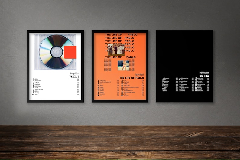May include: Three framed posters of Kanye West albums: Yeezus, The Life of Pablo, and Donda. Each poster features the album cover art and a tracklist.