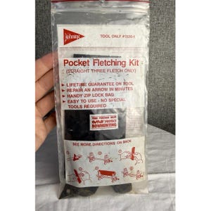May include: A clear plastic bag containing a Pocket Fletching Kit. The bag has red and white text that reads "Bohning" and "Pocket Fletching Kit". The kit is designed for straight three fletch arrows. The bag also includes instructions and a guarantee.