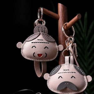 Großvater und Großmutter-Puppen-Anhänger-Anhänger, handgemachtes Auto-Schlüsselbund-Taschen-Anhänger, handgemachtes Leder-Handwerk