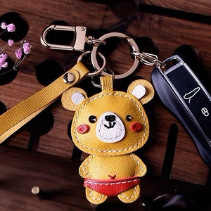 Porte-clés jaune petit ours cartable pendentif personnalisation pur porte-clés de voiture fait main sac pendentif artisanat en cuir fait main