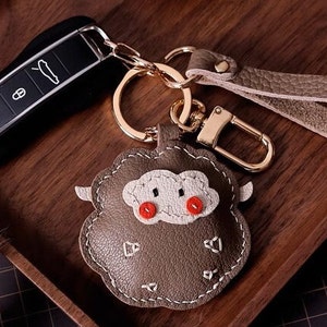 Porte-clés rond en forme de mouton, pendentif de cartable, personnalisation de sac de porte-clés de voiture fait main, artisanat en cuir fait main