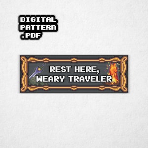 May include: A pixel art design featuring the text "REST HERE, WEARY TRAVELER" in a gold-framed rectangle, with a wizard and campfire illustration. A separate black square reads "DIGITAL PATTERN .PDF".