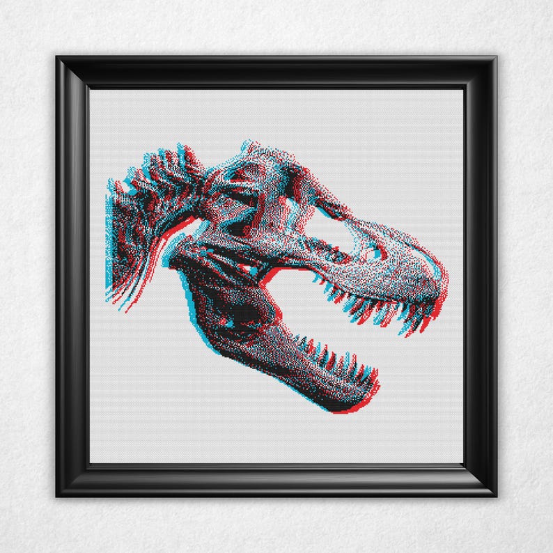 Digital rendering of a cross stitch on white aida cloth in a black frame of a bitmap style Tyrannosaurus rex, or t-rex, dinosaur skull in an anaglyph 3d style with cyan on the left and red on the right and offset vertically by a few stitches.
