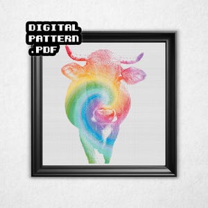 May include: A framed digital pattern featuring a colorful cow illustration. The cow's head is rendered in a rainbow swirl design, with a black frame. The text "DIGITAL PATTERN .PDF" is in the upper left corner.