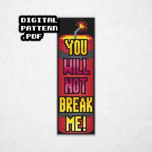 May include: A digital PDF cross-stitch pattern featuring a dynamite design with the text "YOU WILL NOT BREAK ME!" in yellow and pink. The top of the dynamite has a lit fuse. The background is black.