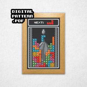 May include: Framed cross-stitch pattern featuring a Tetris game design. The artwork displays colorful blocks in a classic Tetris arrangement, with the word "NEXT:" and a preview of the next piece. The frame includes the text "DIGITAL PATTERN .PDF".