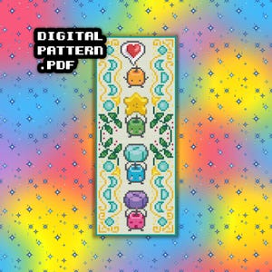 May include: A digital PDF cross-stitch pattern featuring a vertical design with pixelated characters. The design includes a heart, star, and other cute characters in various colors. The text "DIGITAL PATTERN .PDF" is at the top left.