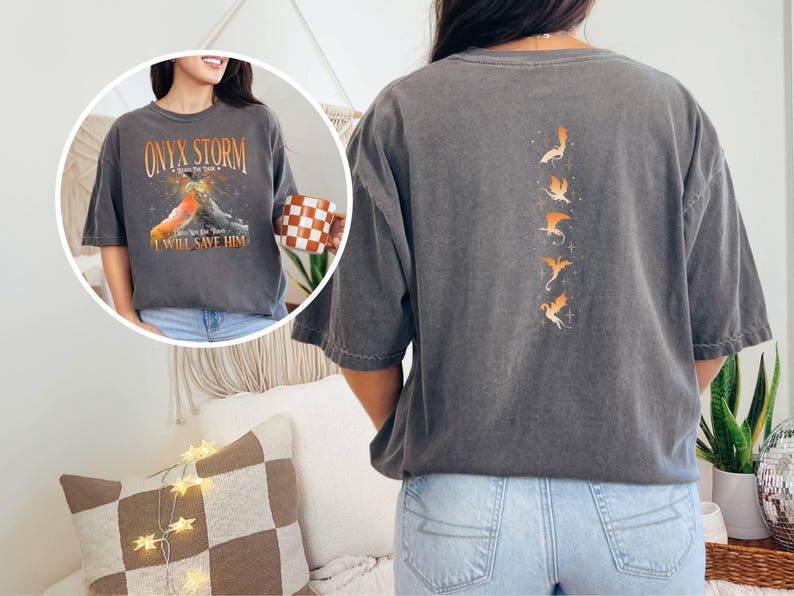 May include: A gray t-shirt with a graphic of a dragon and the text "Onyx Storm" and "I Will Save Him". The back of the shirt has a graphic of five dragons.