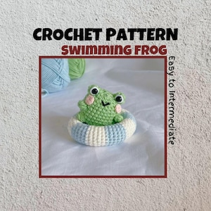 May include: A green crocheted frog wearing a blue and white crocheted inner tube. The frog has pink cheeks and black eyes. The image is labeled "Crochet Pattern Swimming Frog Easy to Intermediate".