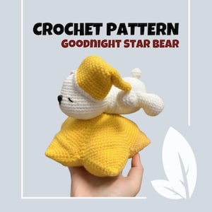 May include: Crochet pattern for a white bear wearing a yellow sleeping cap, lying on a yellow star. The pattern is called "Goodnight Star Bear".