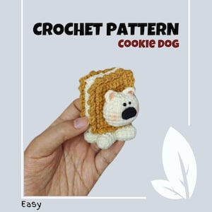 May include: Crochet pattern for a cookie dog amigurumi. The dog is made to look like a cookie sandwich with brown and white yarn. The pattern is labeled "Easy".