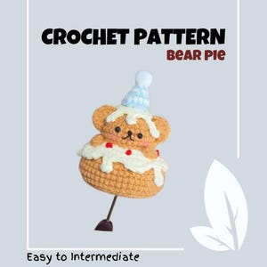 May include: Crochet pattern for a bear-shaped pie with a blue and white party hat. The pattern is described as easy to intermediate.
