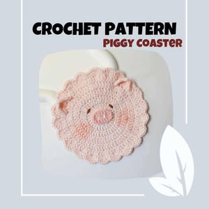 May include: A handmade, light pink crochet coaster in the shape of a pig. The coaster has a scalloped edge, small ears, and a detailed snout. The text "CROCHET PATTERN PIGGY COASTER" is at the top of the image.