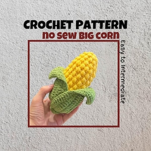 Puede incluir: Patrón de crochet para un maíz grande sin coser. Nivel de dificultad fácil a intermedio. El maíz es amarillo con hojas verdes.
