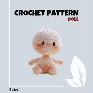 Peut inclure: Un patron de poupée au crochet pour une poupée simple et facile à réaliser. La poupée est rose et a un visage simple avec des yeux noirs. Le patron est intitulé "Facile" et "Poupée".