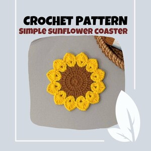 May include: A crocheted sunflower coaster with a brown center and yellow petals. The text "CROCHET PATTERN SIMPLE SUNFLOWER COASTER" is displayed at the top of the image. The coaster is placed on a gray surface.