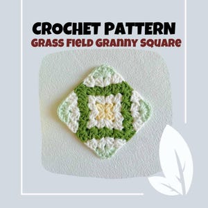 May include: A crocheted granny square with a grass field design. The square features a central yellow flower, surrounded by white, green, and light green yarn. The text "CROCHET PATTERN GRASS FIELD GRANNY SQUARE" is at the top.