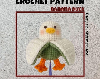 May include: Crochet pattern for a banana duck amigurumi. The duck is white with green wings and orange feet. The pattern is labeled "Easy to Intermediate".
