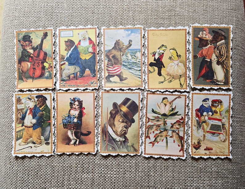 May include: A collection of ten vintage-style postcards featuring anthropomorphic animals in various scenes. The illustrations include bears, cats, frogs, and a bulldog, each dressed in clothing and engaged in activities like playing music or attending a party.