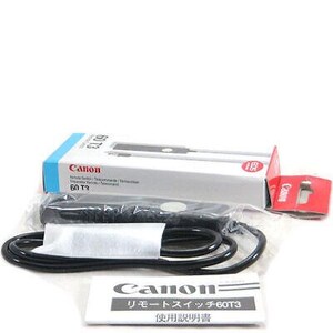 May include: A black Canon remote switch for cameras, labeled "60T3", with a black cable and a white instruction manual in Japanese that says "Remote Switch 60T3 Instructions".