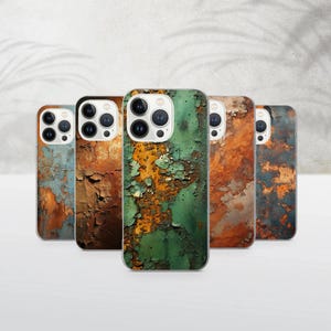 May include: A collection of five phone cases with a weathered, textured design. The cases feature a variety of colors, including shades of blue, green, and orange, with a distressed, peeling paint effect. The cases are arranged in a semi-circle.