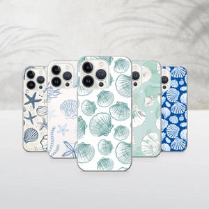 May include: A collection of five phone cases with various seashell and starfish designs. The cases feature patterns in shades of blue, white, and green. The designs include detailed illustrations of seashells and starfish.
