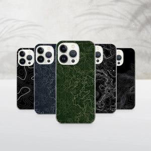 May include: Five phone cases with topographic map designs. The cases feature a variety of colors, including black, navy, and green. The cases are arranged in a row, showcasing the different map patterns.