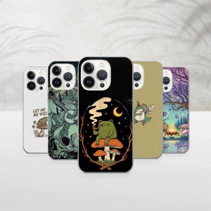 May include: A collection of phone cases with whimsical designs. One case features a frog smoking a pipe on a mushroom, another has a frog playing guitar, and a third displays the text "LET ME BE WEI". The cases have a variety of colors and illustrations.