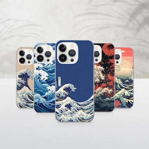 May include: A selection of phone cases showcasing the famous Japanese artwork "The Great Wave off Kanagawa." The cases display the artwork in various colours, including blue, beige, red, and black, depicting the wave and Mount Fuji.