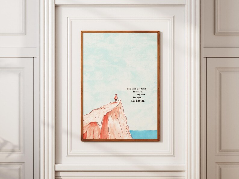 Digital illustration of a person standing at the edge of a red cliff, gazing out over the ocean under a soft blue sky. The right side of the artwork features the famous motivational quote: “Ever tried. Ever failed. No matter. Try again. Fail again. Fail better.” in bold text. This inspirational digital wall art encourages resilience and is perfect for printing and displaying in offices, dorm rooms, or therapy spaces as a reminder to persevere.