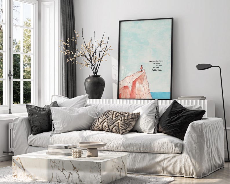Digital illustration of a person standing at the edge of a red cliff, gazing out over the ocean under a soft blue sky. The right side of the artwork features the famous motivational quote: “Ever tried. Ever failed. No matter. Try again. Fail again. Fail better.” in bold text. This inspirational digital wall art encourages resilience and is perfect for printing and displaying in offices, dorm rooms, or therapy spaces as a reminder to persevere.